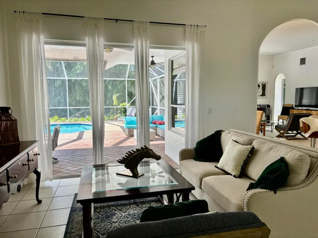 Living Room with the entrance to the screened​​‌​​​​‌​​‌‌​‌‌​​​‌‌​‌​‌​‌​​​‌​​ patio