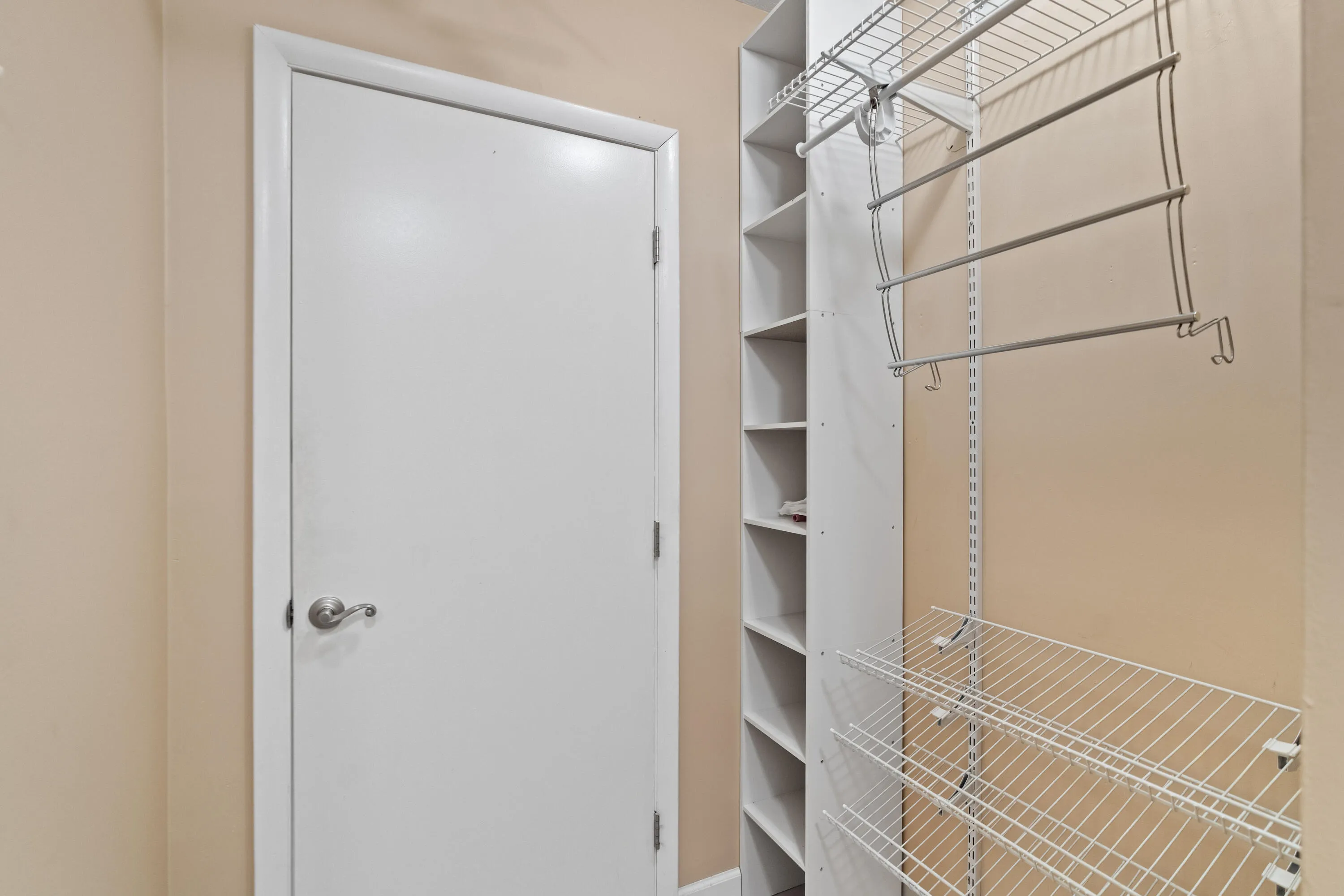 Primary bedroom walk-in closet