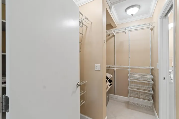 Primary bedroom walk-in closet