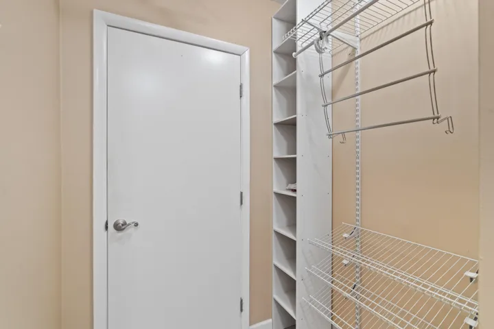 Primary bedroom walk-in closet