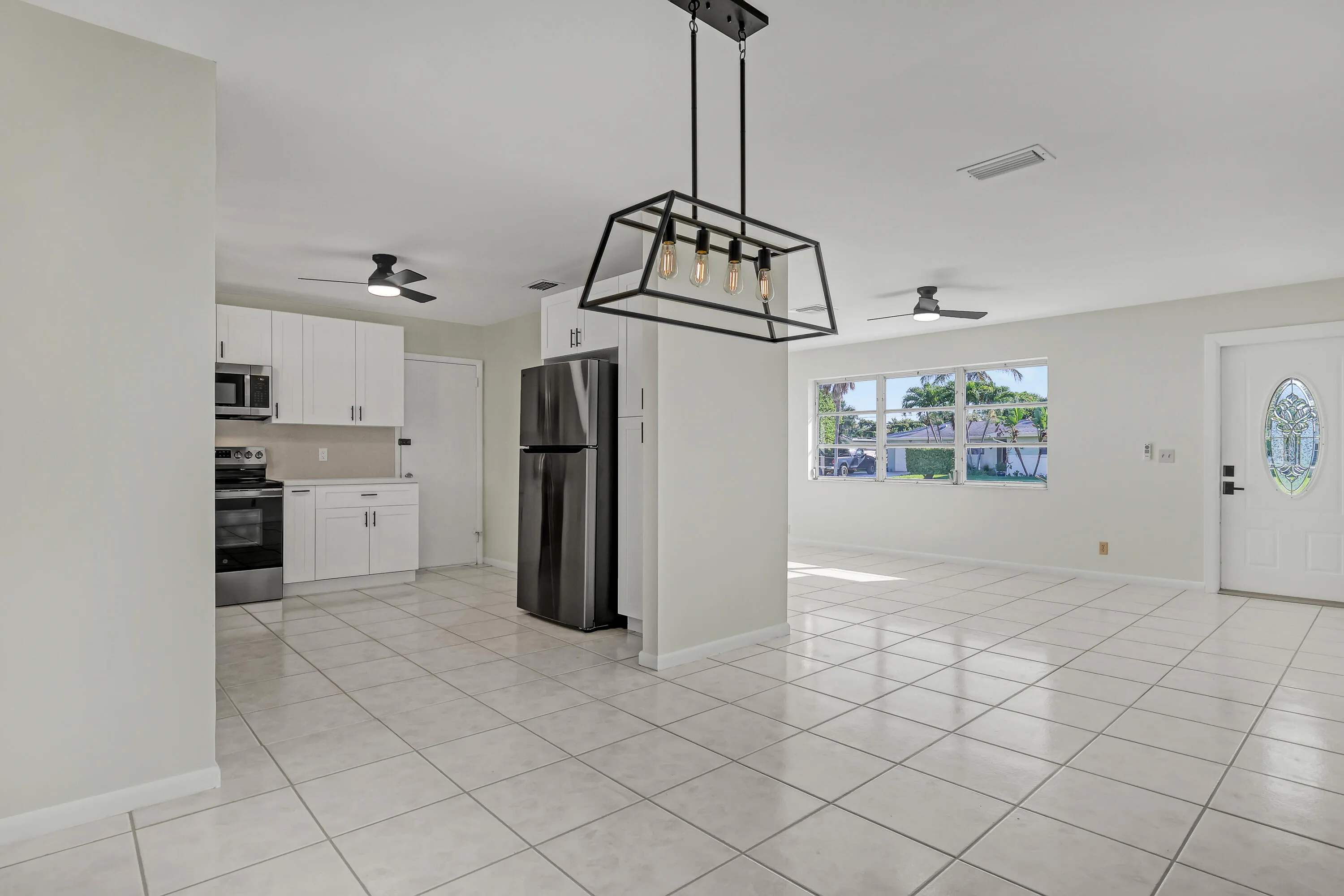 Cook and chat while keeping an eye on the pool and the dining room — everything connects.