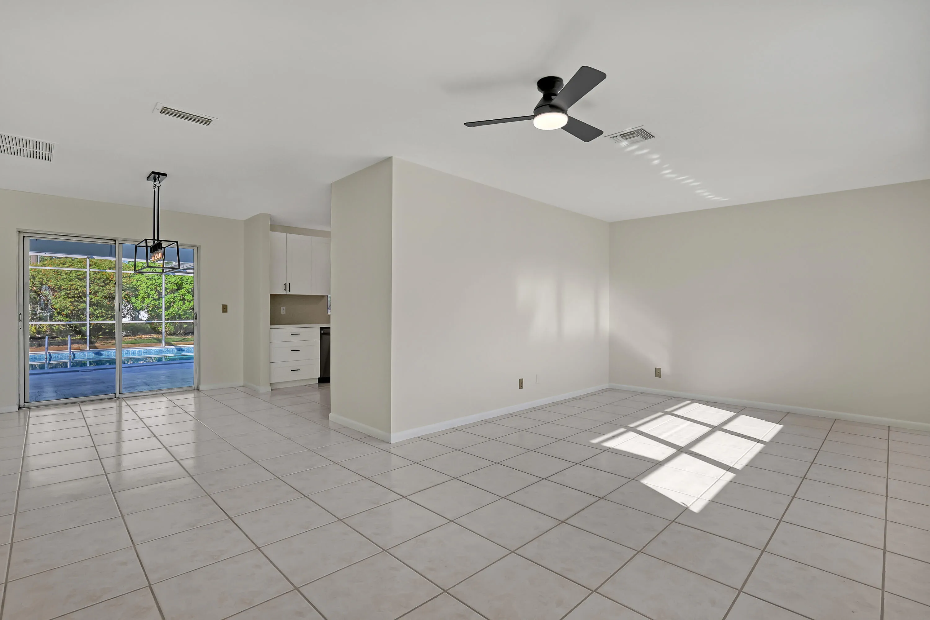 The living space opens right up to the water — the kind of connection that makes a house live bigger.
