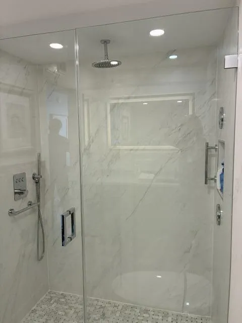 New shower w/3 shower heads & grab bars.