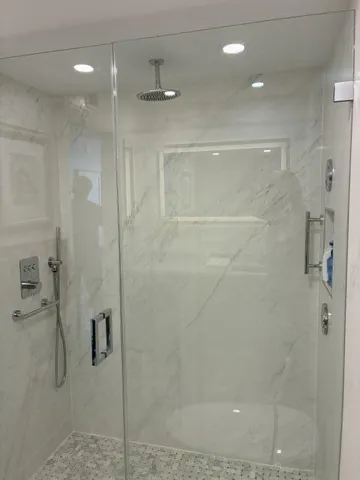 New shower w/3 shower heads & grab bars.