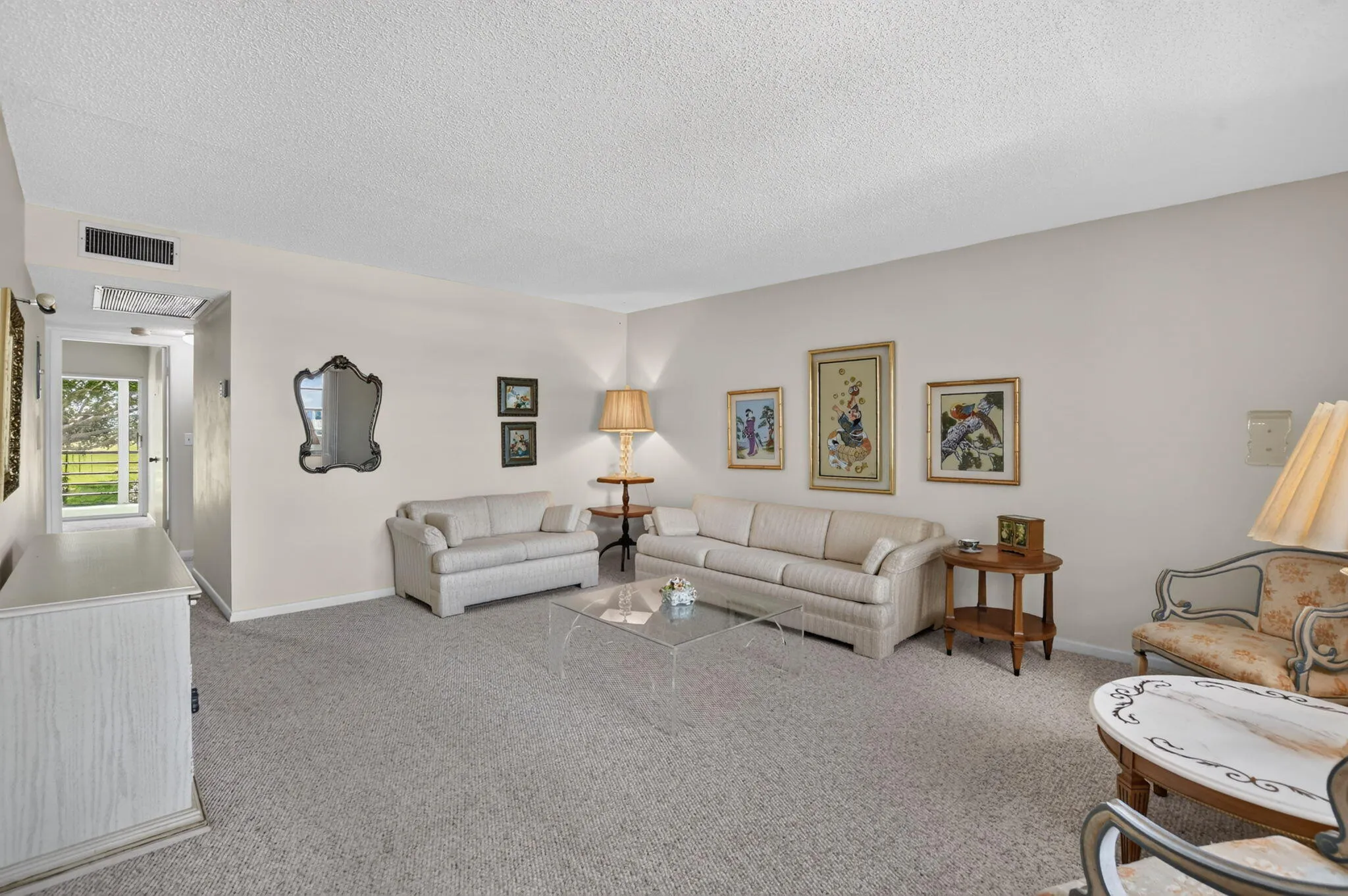 Living room is full of natural light, creating a warm and inviting space!