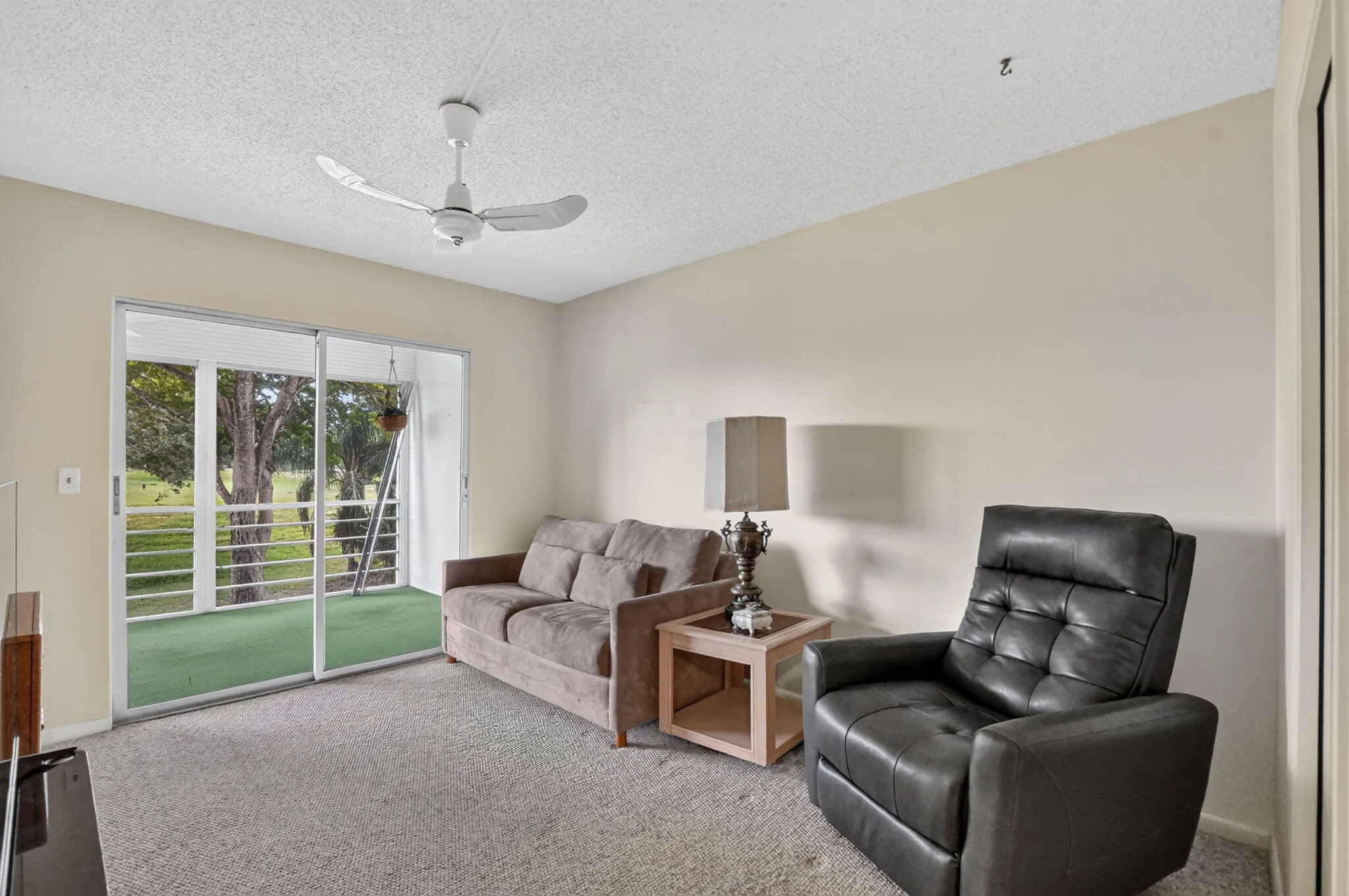 Guest bedroom features walk-in closet and access to the screened patio!