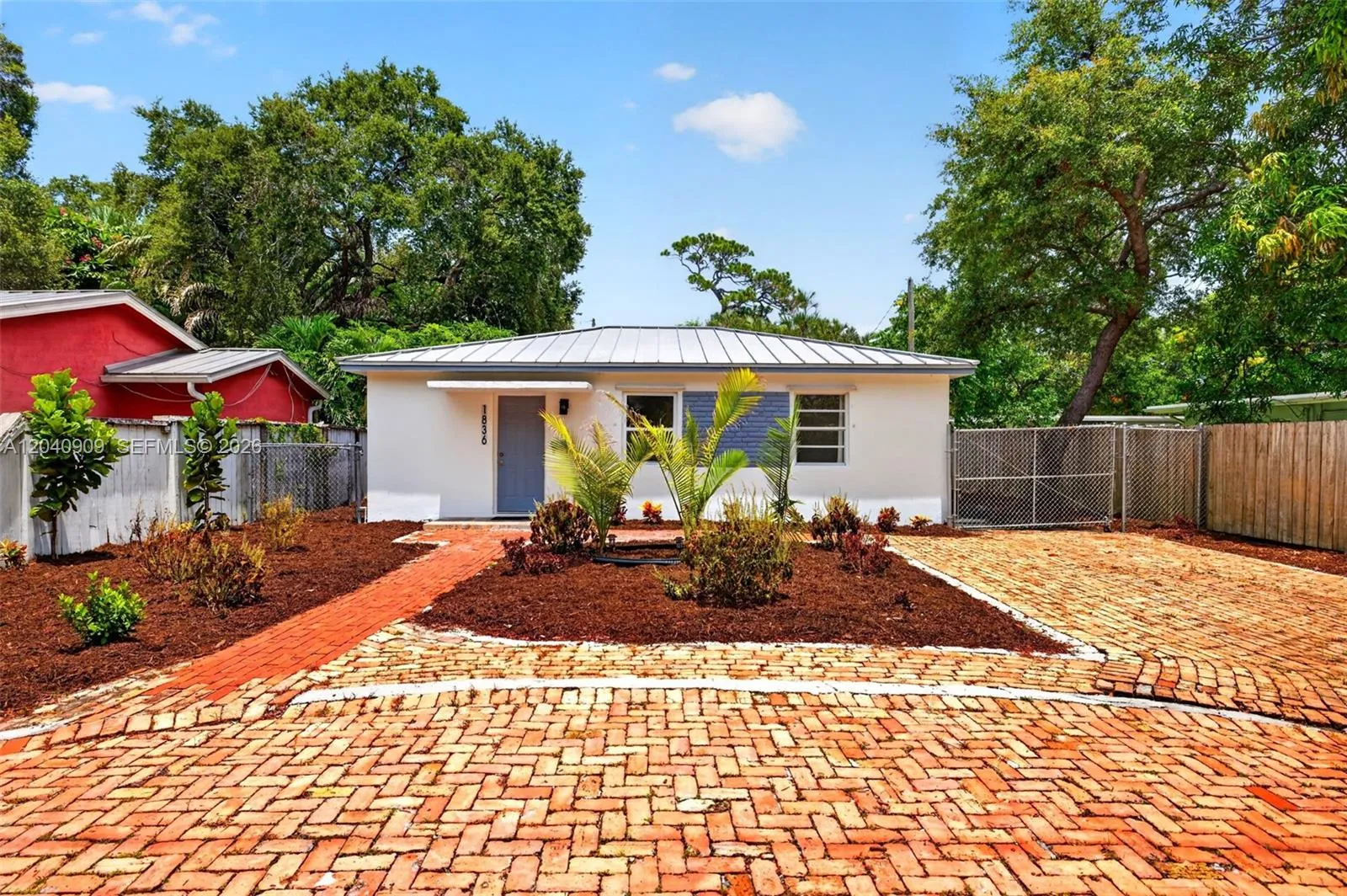 Circular Driveway / Chicago Brick style with another driveway leading to side gate where you can store a trailer / RV / Food Truck or work equipment. Nice mature plants.