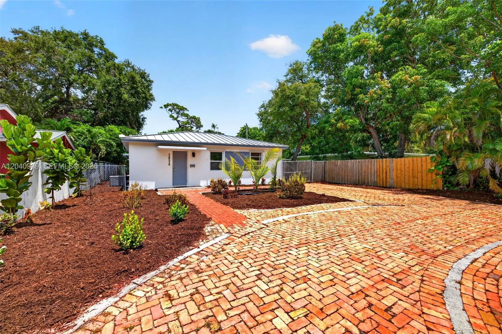 Circular Driveway / Chicago Brick style with another driveway leading to side gate where you can store a trailer / RV / Food Truck or work equipment. Nice mature plants.