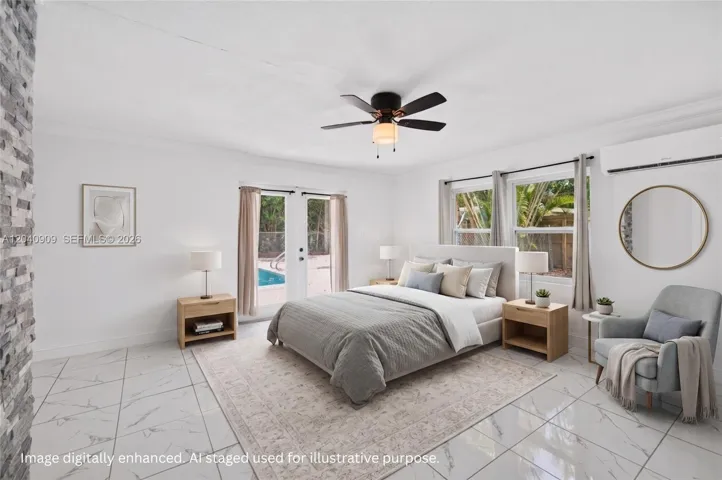 Primary bedroom with french doors to the pool area. Room also has the washer / dryer, closet and full bathroom. Image digitally enhanced. AI used for staging purposes