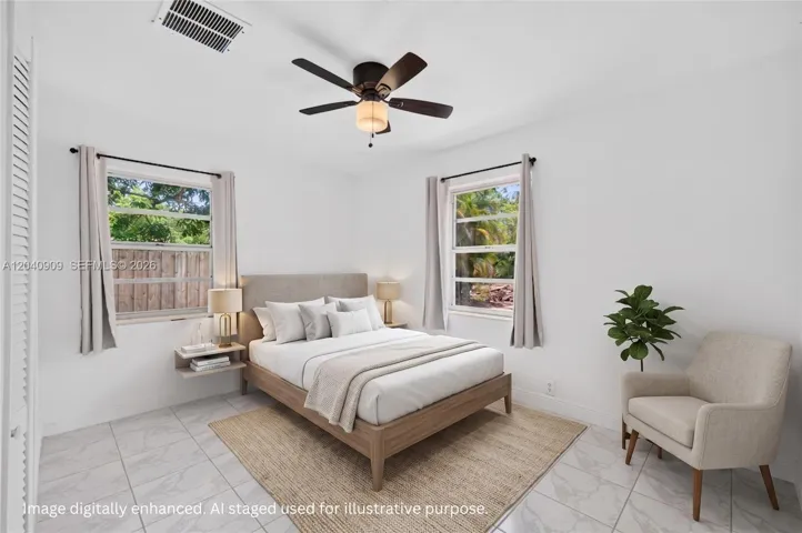 On of the guest bedrooms toward front of house. Overlooks front yard and side yard. Image digitally enhanced. AI used for staging purposes