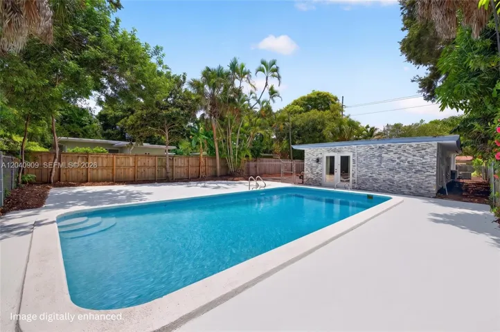 Pool area, deck cleaned via AI but the plants are all real! Image digitally enhanced. AI used for staging purposes