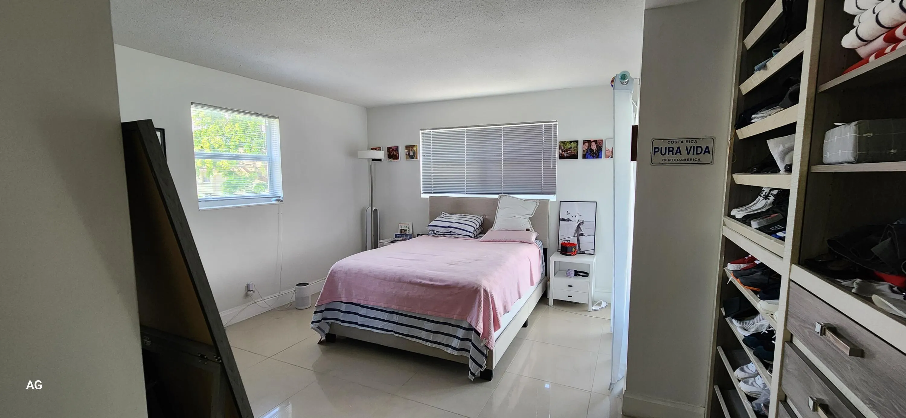 Primary bedroom with private bathroom and patio access