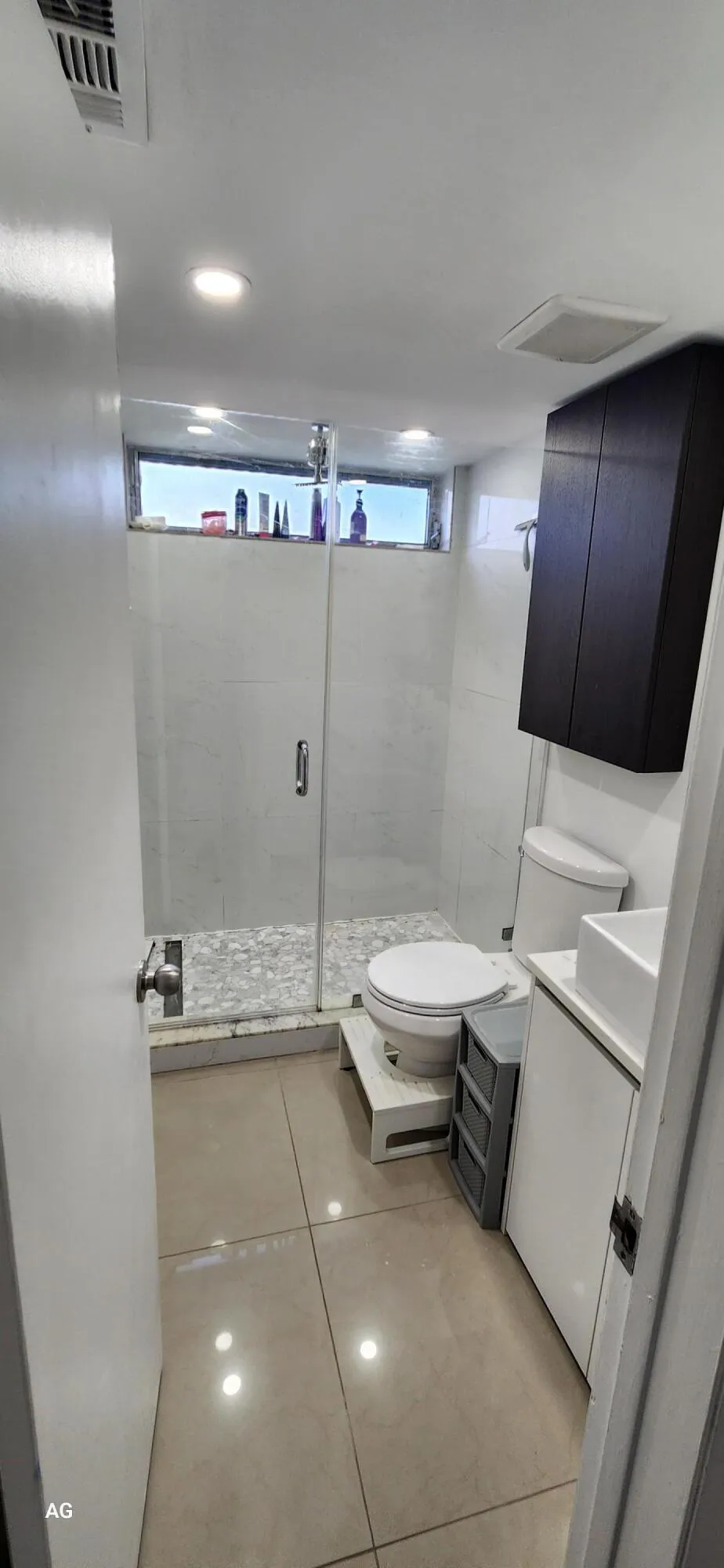 Guest full Bathroom - glass enclosed shower light and bright