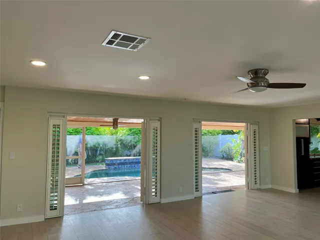 Open doors to the screened in patio area