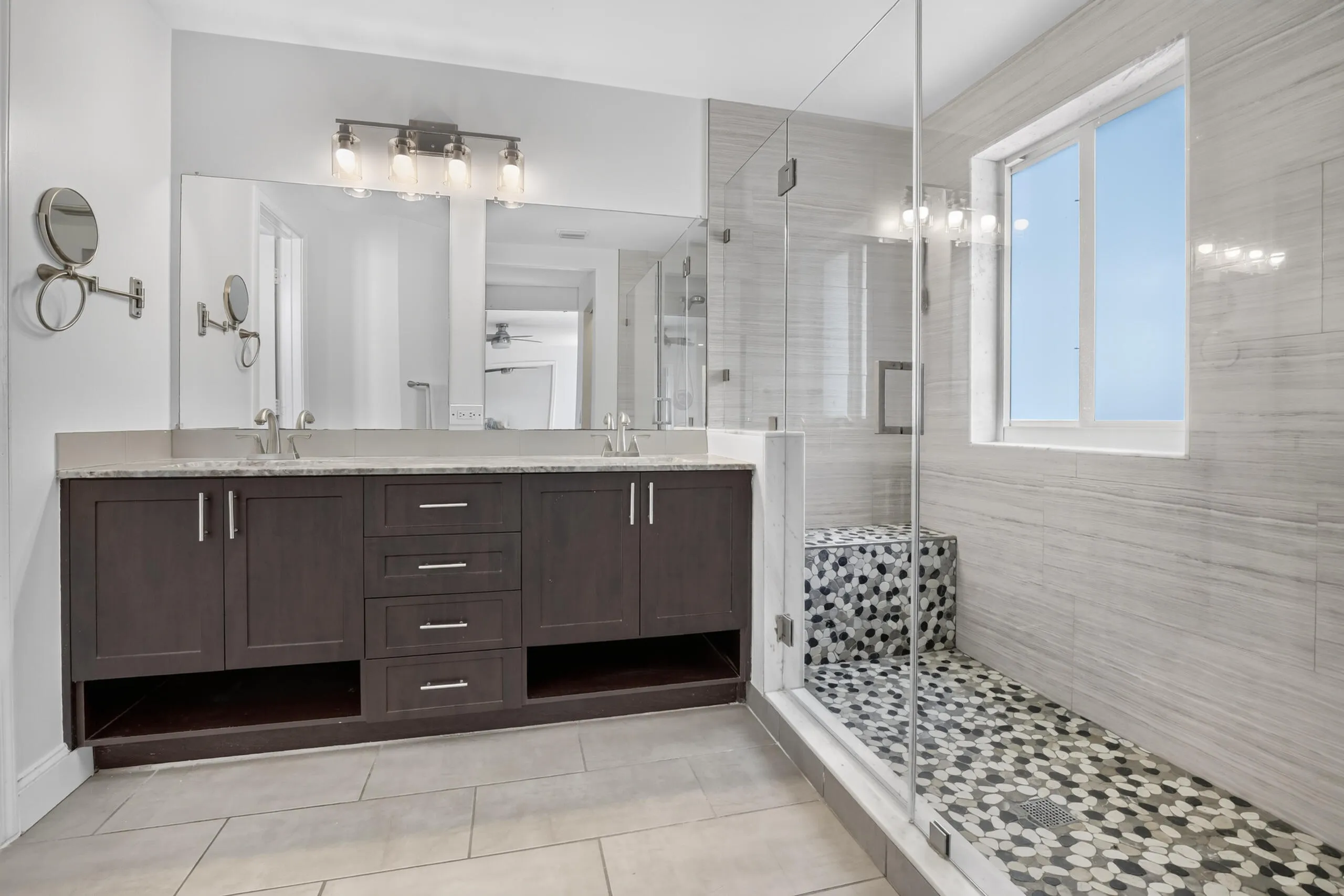 Updated primary bathroom with luxurious oversized walk in shower