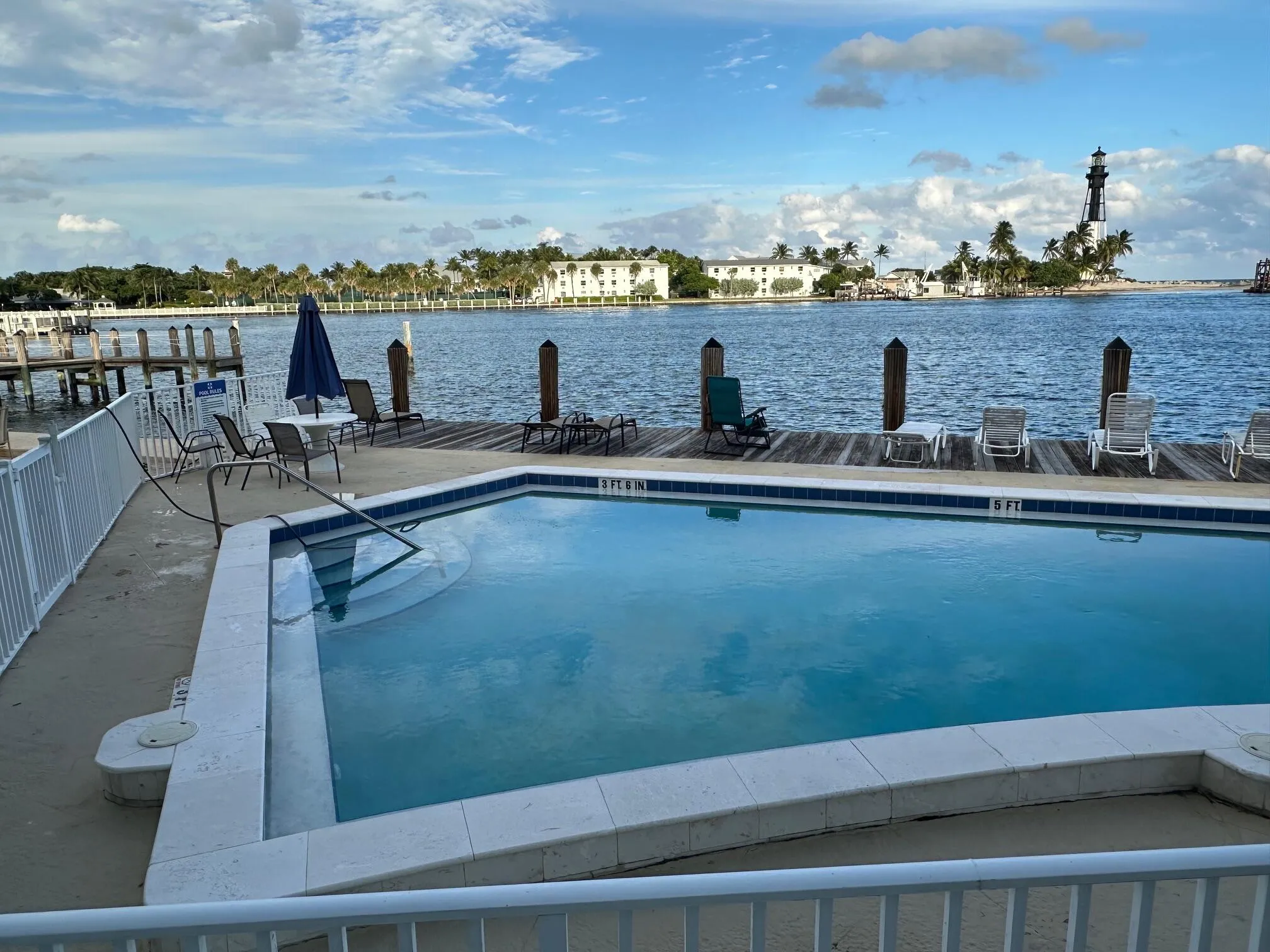 Relax and unwind in the waterfront pool overlooking the inlet, where you can swim while enjoying panoramic water views, refreshing coastal breezes, and the beauty of boats cruising by—a truly resort-style setting.