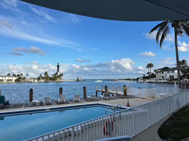 Waterfront View from Balcony: Enjoy sweeping waterfront vistas from the private balcony, where tranquil Intracoastal views, passing yachts, and the iconic Hillsboro Inlet Lighthouse create a picturesque backdrop for morning coffee, sunset cocktails, or simply relaxing while taking in the coastal scenery.