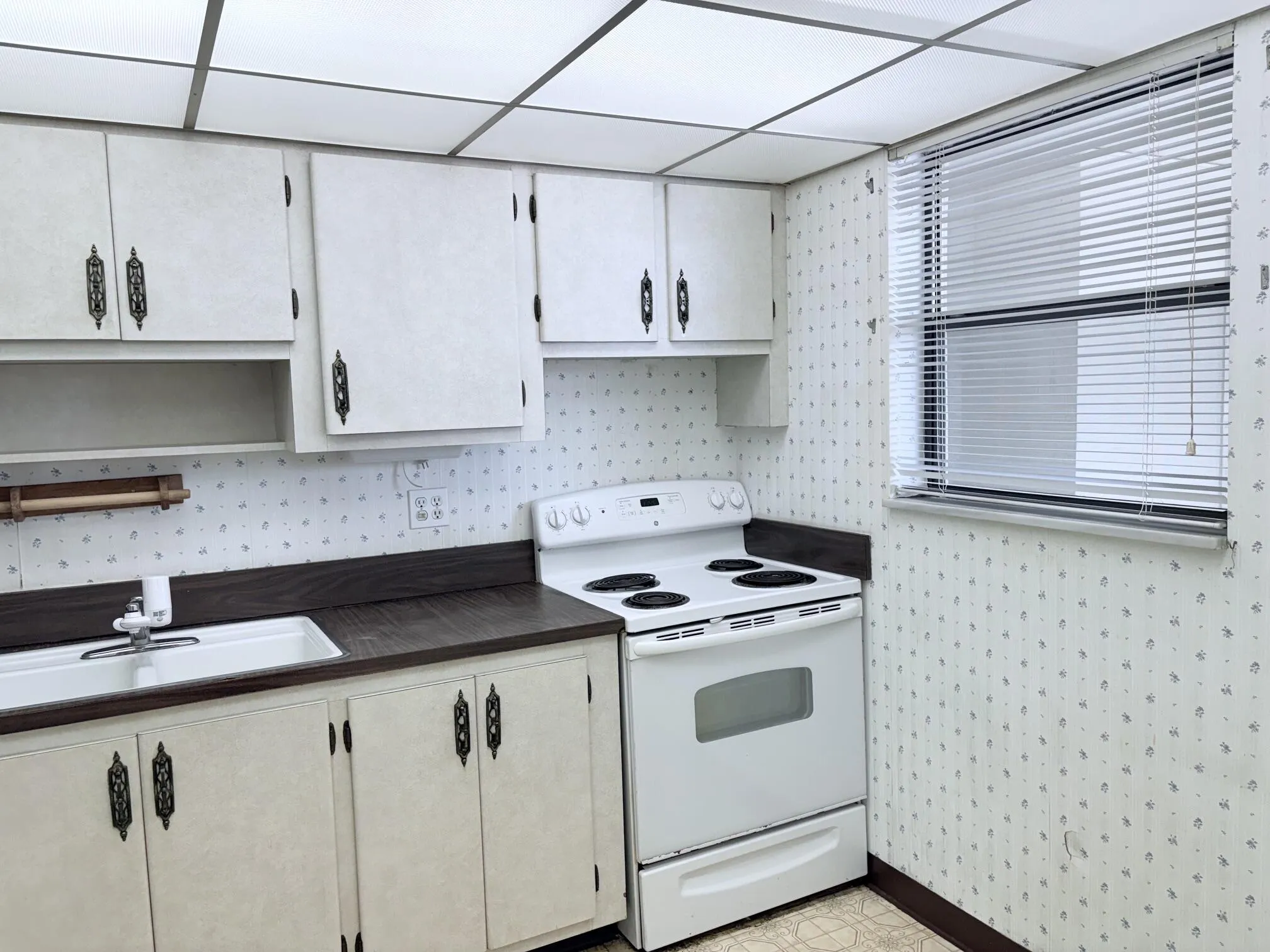 Nice size kitchen with a window.