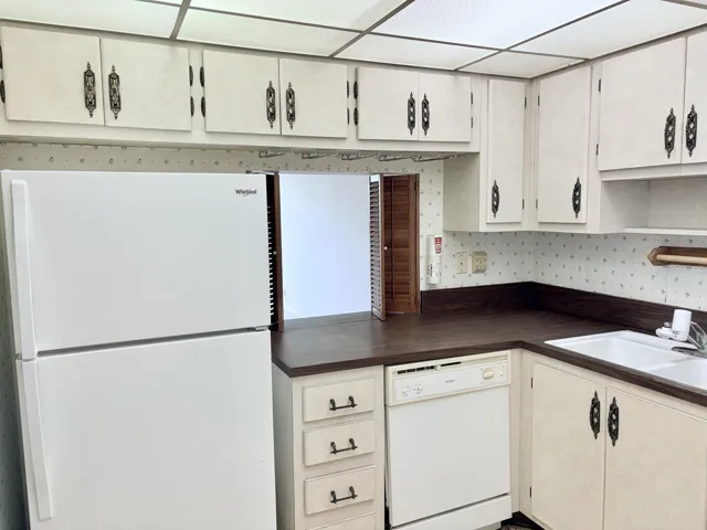 Kitchen with a peep thru to the living/dining area.