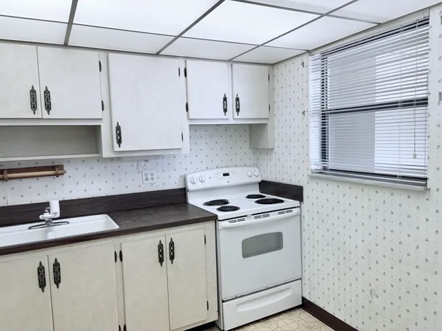 Nice size kitchen with a window.