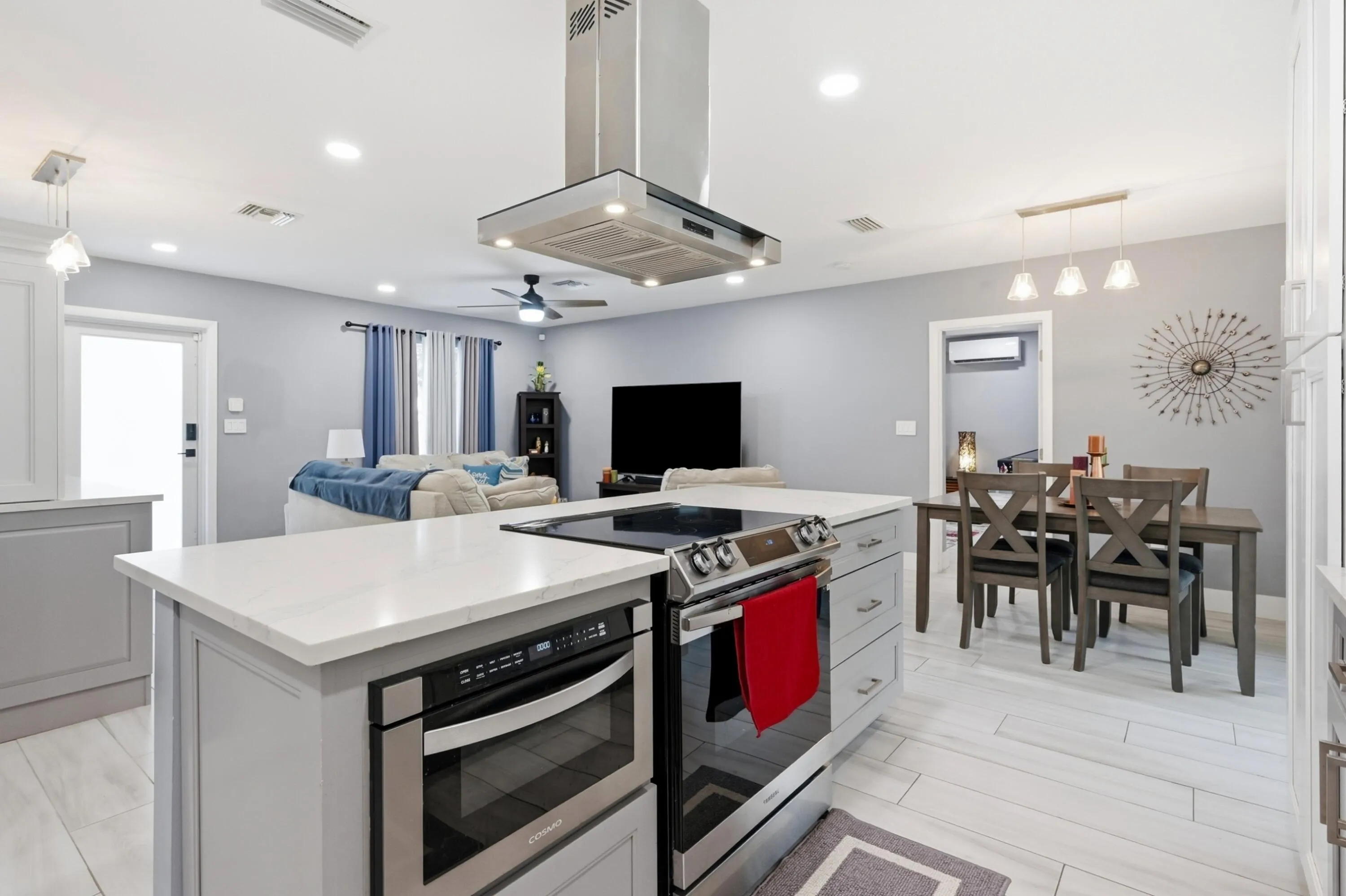 Large island, bar, and beverage cooler create the perfect gathering space for family and friends.