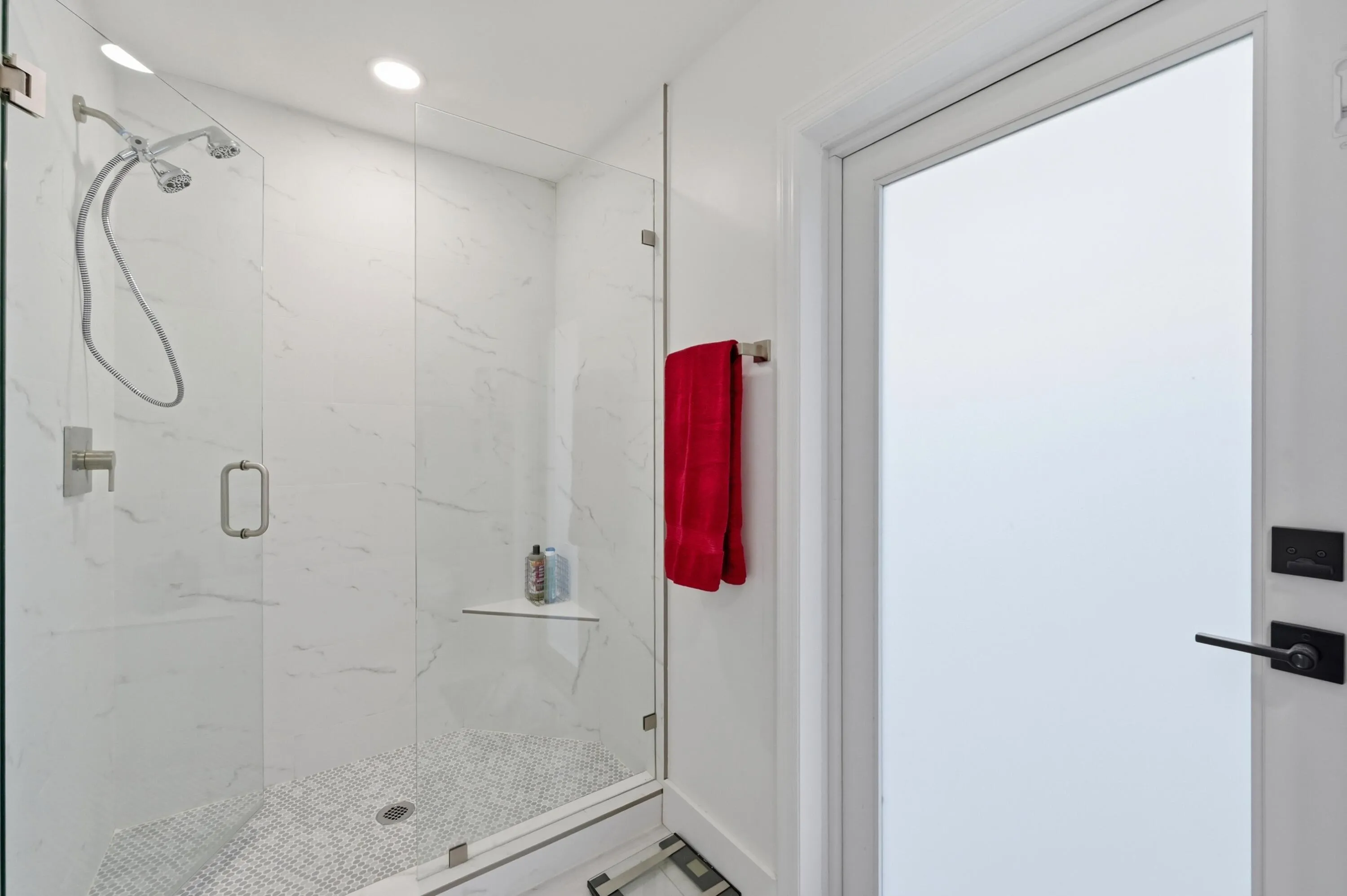 Beautifully renovated private bathroom completes the second primary suite with style and comfort.
