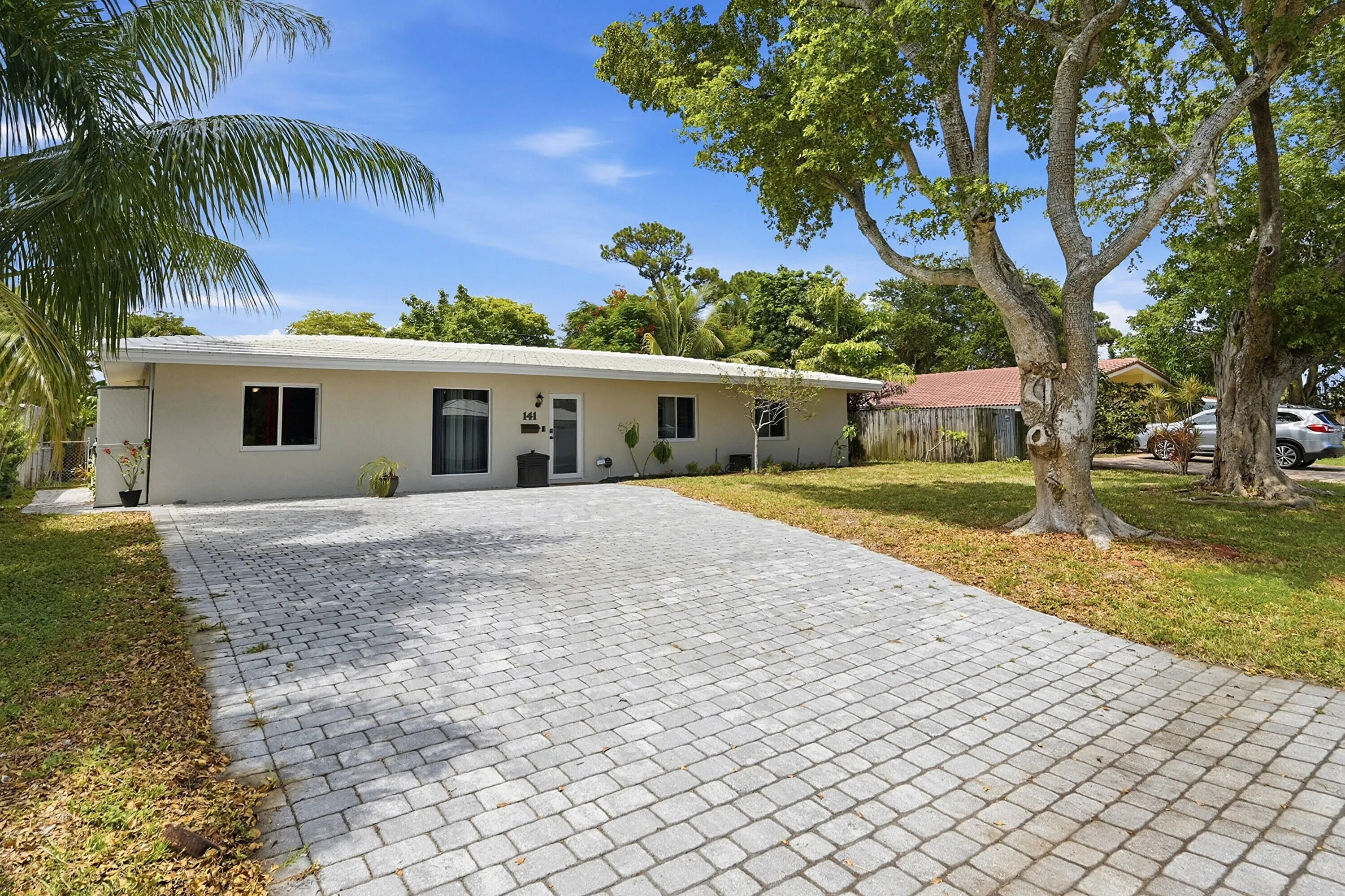 New paver driveway provides exceptional curb appeal and generous parking for family and guests.