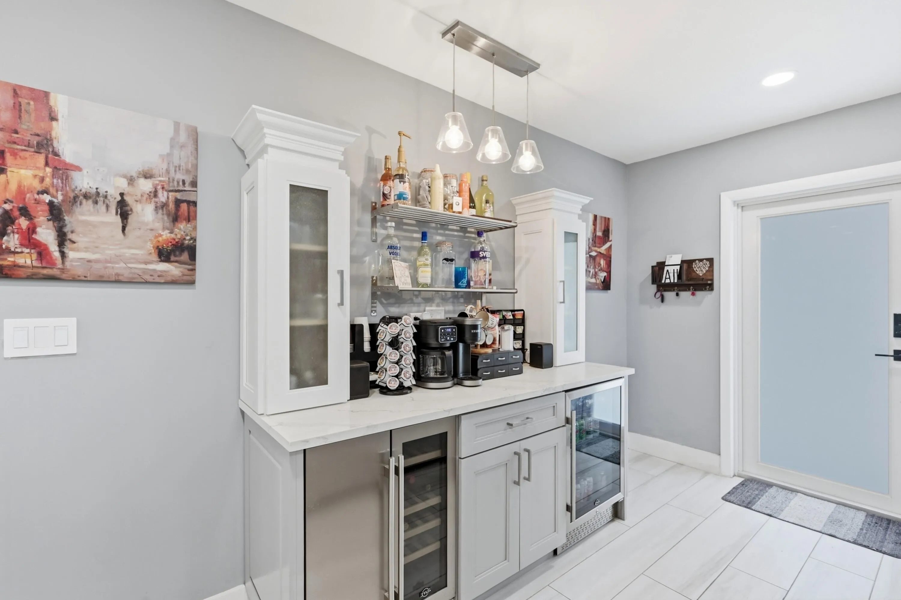 Dedicated beverage station with built in cooler enhances both everyday living and entertaining.