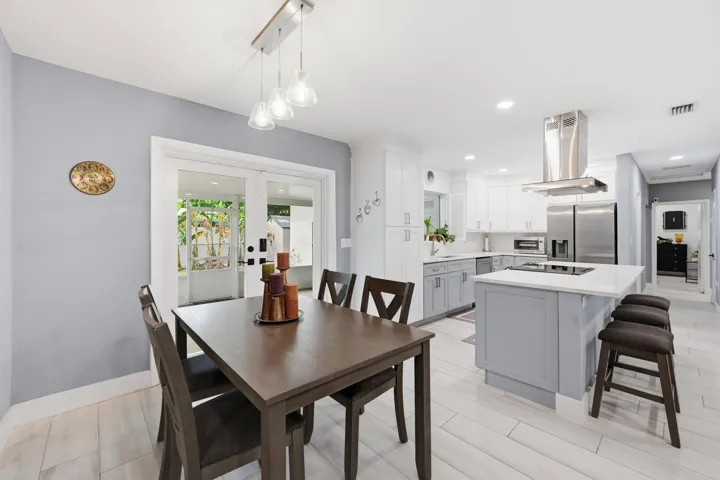Thoughtfully designed spaces flow effortlessly from the kitchen to the dining area, making everyday living both comfortable and inviting.