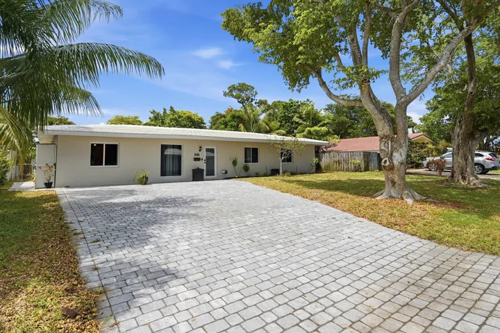New paver driveway provides exceptional curb appeal and generous parking for family and guests.