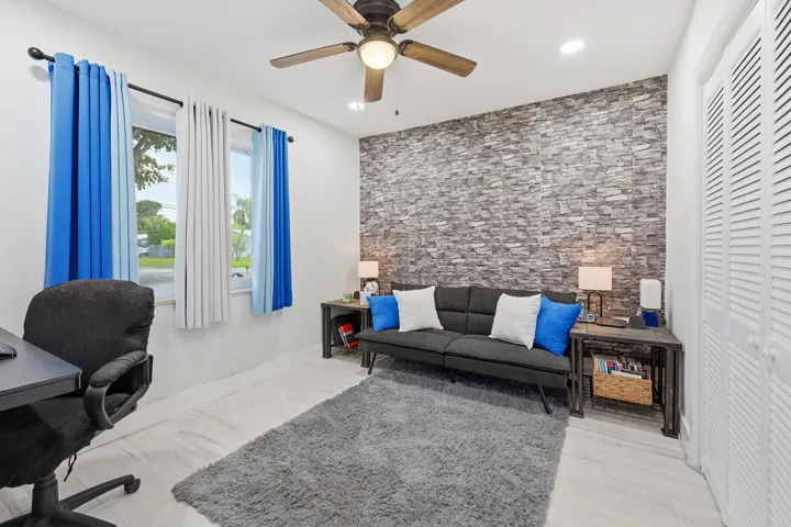 Bright and inviting bedroom with generous space for family, guests, or a home office.