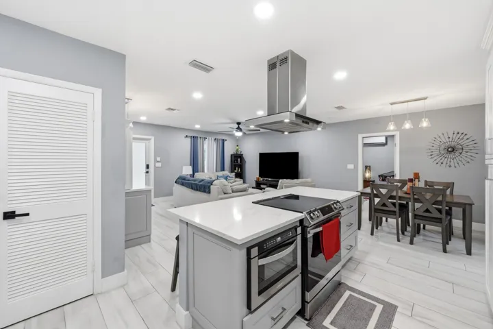 The heart of the home, this beautifully renovated kitchen combines modern design with exceptional functionality.