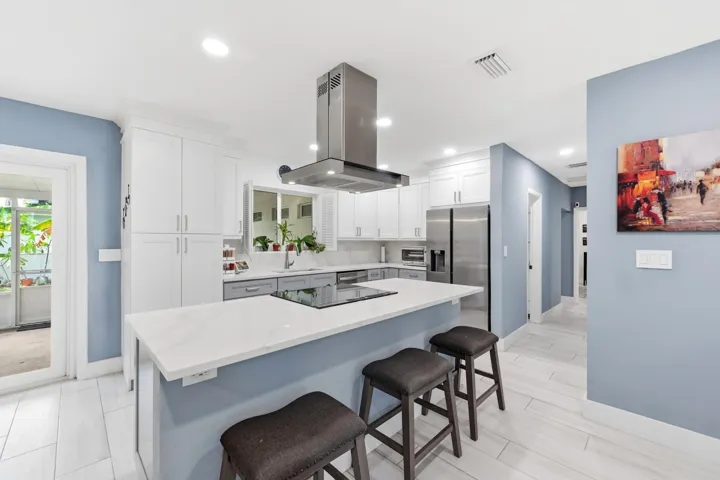 Abundant workspace, quality finishes, and thoughtful updates make this kitchen as practical as it is inviting.
