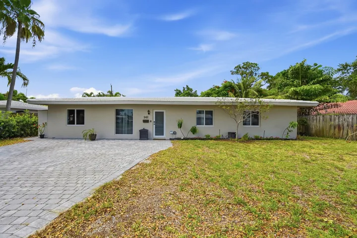 New driveway, impact windows and doors, and exceptional pride of ownership welcome you home.