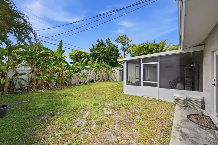 Spacious backyard offers endless possibilities for relaxing, entertaining, gardening, or creating your own outdoor retreat.