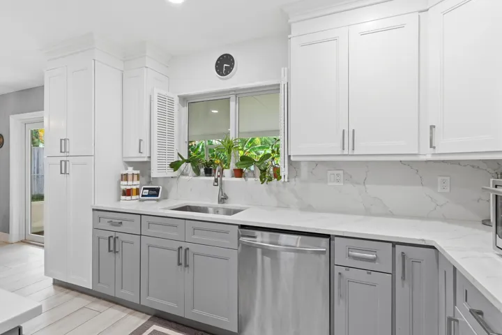 Beautiful cabinetry, quality finishes, and thoughtful updates make this renovated kitchen both stylish and functional.