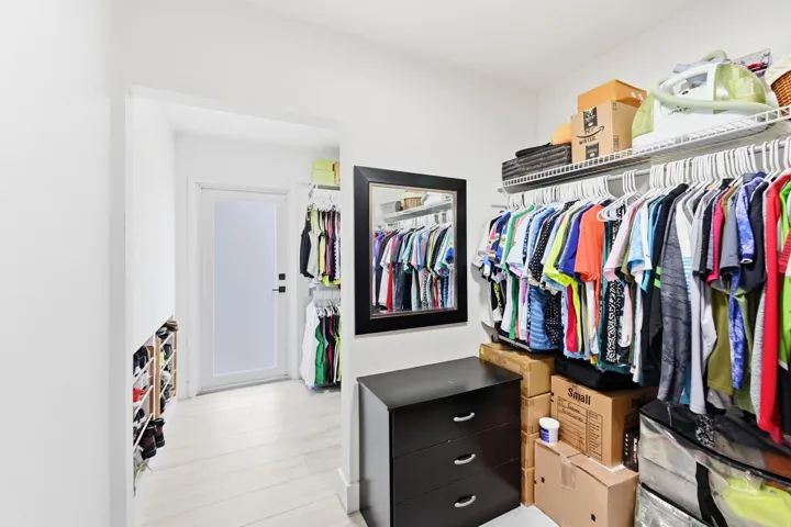 Expansive walk in closet offers exceptional storage and organization for your wardrobe and everyday essentials.