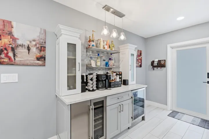 Dedicated beverage station with built in cooler enhances both everyday living and entertaining.