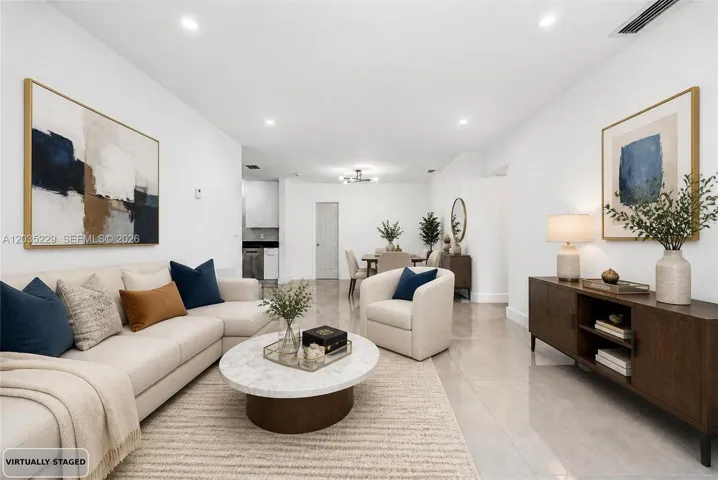 Virtually staged living room showcasing the open-concept layout.