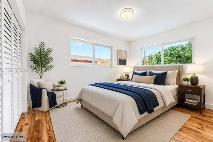 Virtually staged primary bedroom showcasing the room's layout and potential.
