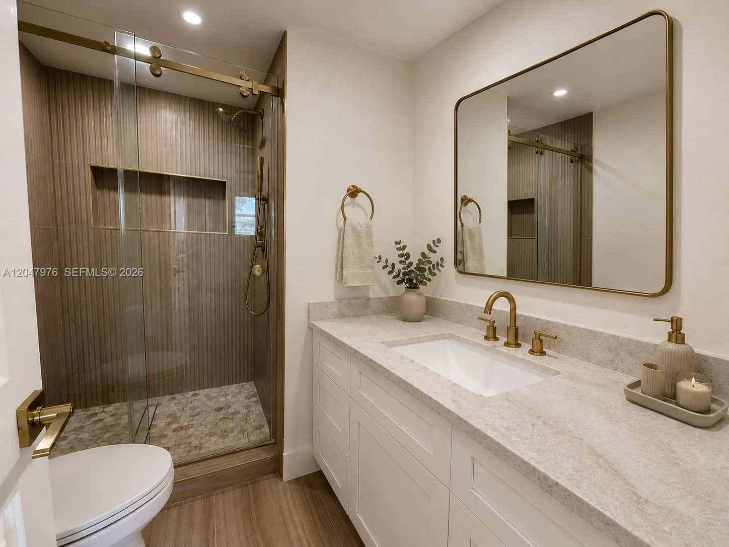 Virtual rendering, new quartzite counters and mirror are being installed.