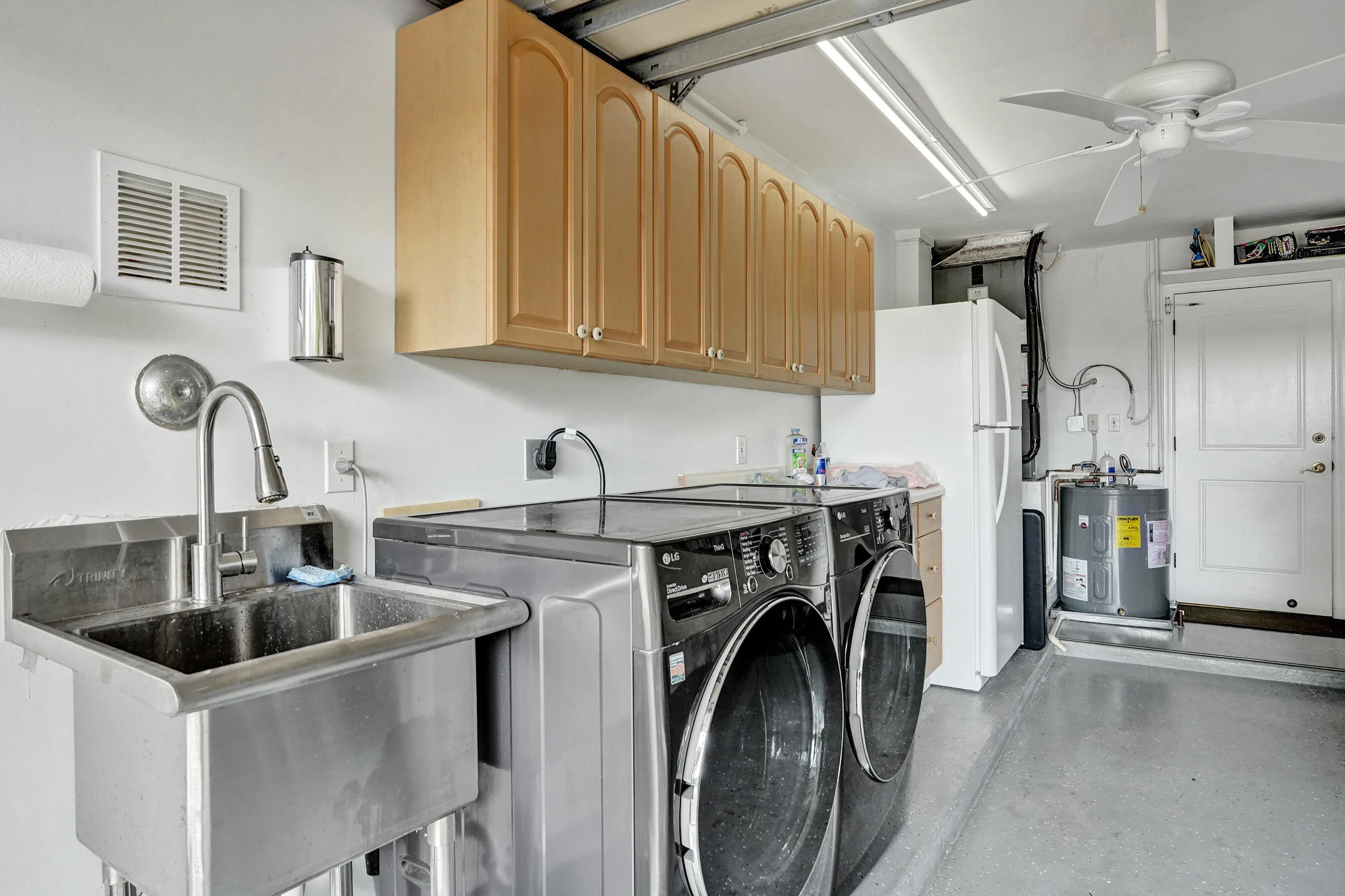 Washer/Dryer, 2nd refrigerator, utility sink; located in garage.