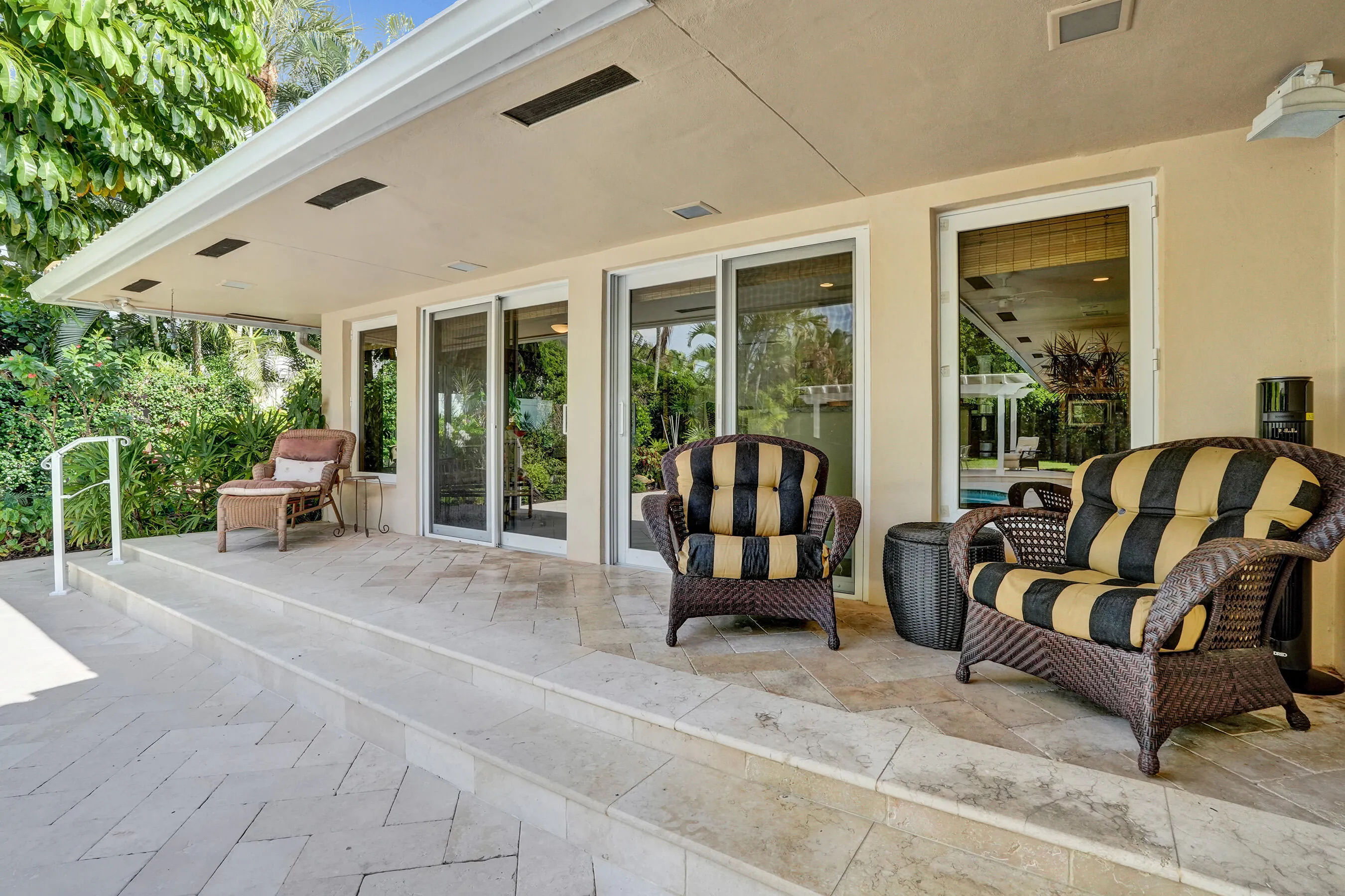 Breakfast nook, kitchen doors leading leading out to pool and backyard area