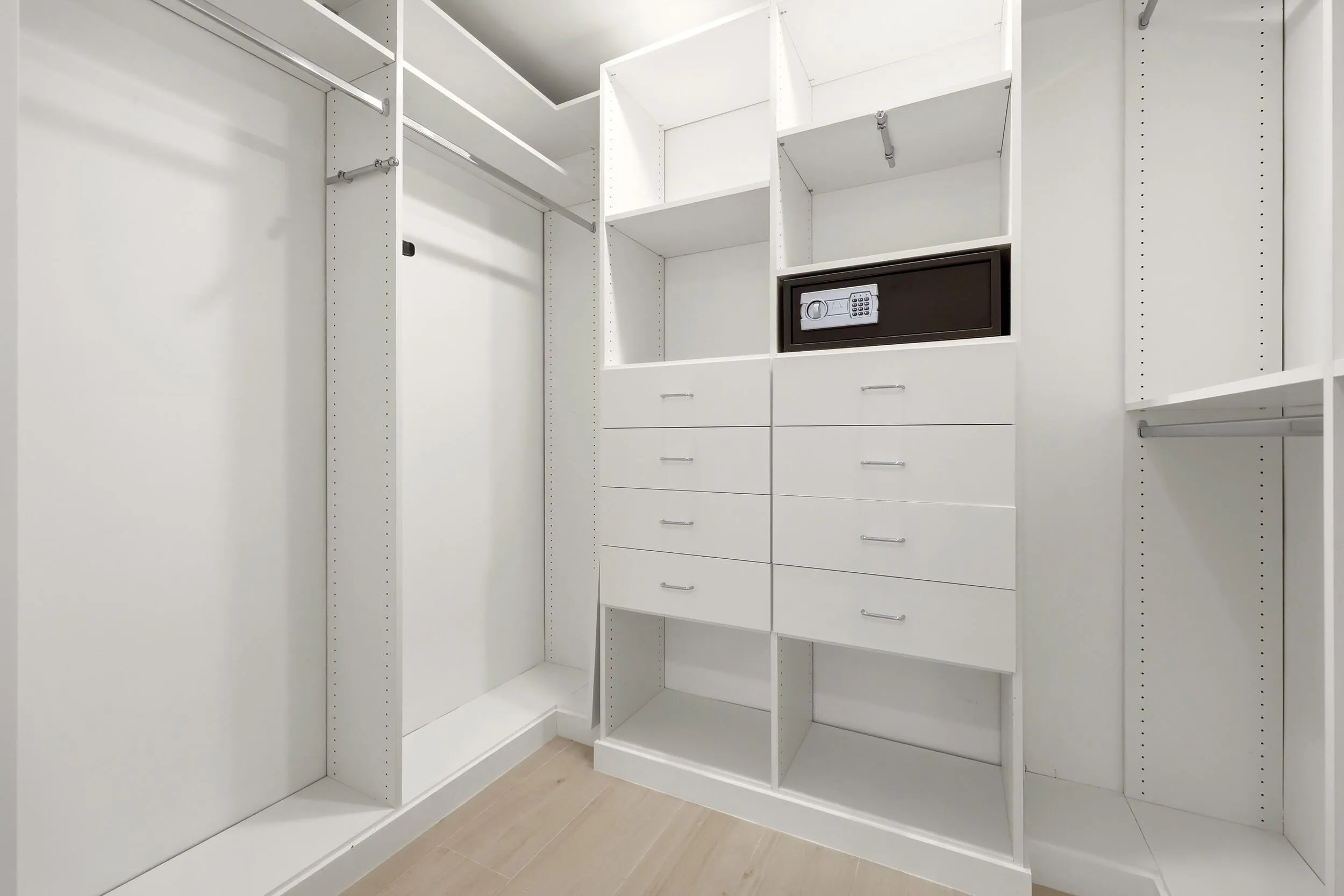 Designed for organization and convenience, this custom walk-in closet offers an impressive amount of storage with built-in shelving, abundant hanging space, multiple drawers, and dedicated accessory storage. Thoughtfully designed to maximize functionality, it provides a boutique-style dressing experience for all of your guests, while keeping everything neatly organized and easily accessible.