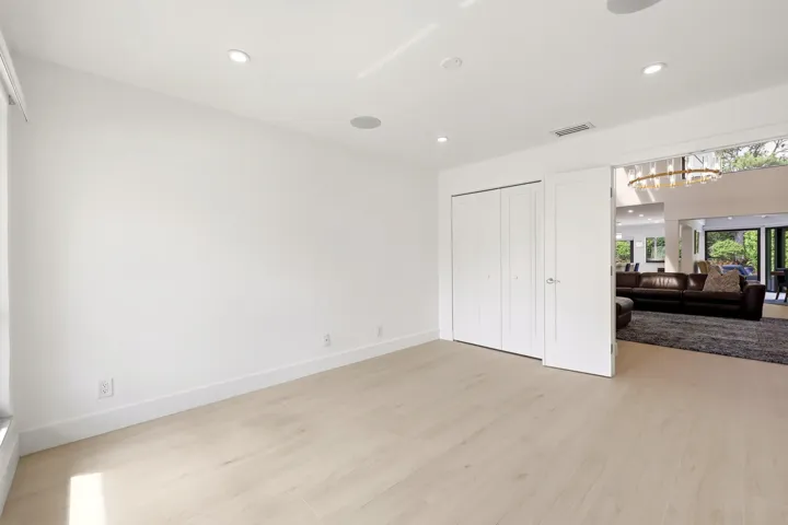 Bright, spacious, and versatile, this generously sized guest bedroom offers abundant natural light, ample closet space, and a clean contemporary design. Perfect for family, guests, or a home office, the room provides a comfortable and private retreat while maintaining easy access to the home's beautifully updated living spaces and nearby guest bathroom.