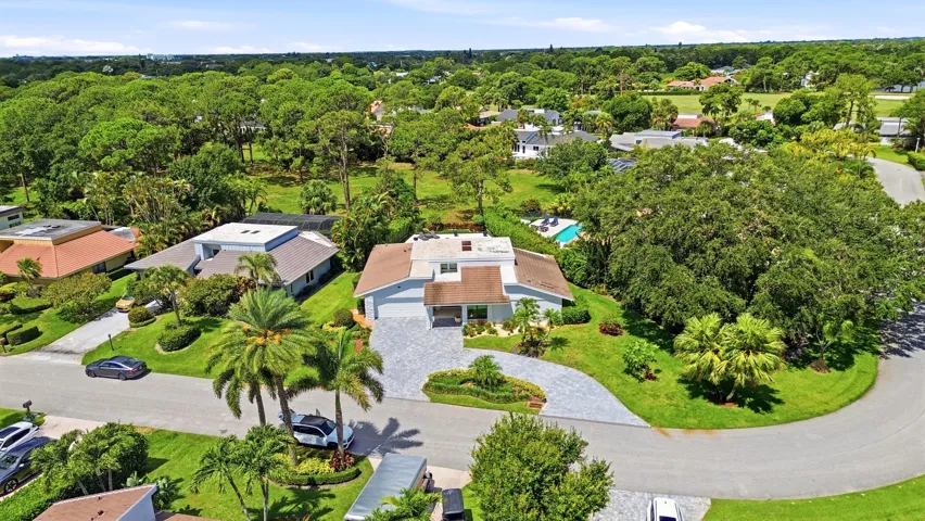 From above, the true rarity of this property comes into focus. Perfectly positioned on an oversized cul de sac lot, the home backs directly to a protected nature preserve, offering an exceptional level of privacy and lush natural surroundings that are seldom found in South Florida. Nestled within the prestigious Seagate Country Club, the only Five Star private club community located just minutes from Downtown Delray Beach, this exceptional residence offers the perfect balance of peaceful seclusion and everyday convenience. Enjoy effortless access to Atlantic Avenue's renowned boutiques, award winning restaurants, pristine beaches, and vibrant coastal lifestyle, all while returning home to the privacy and tranquility of this exclusive setting.