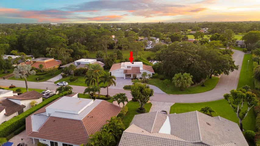 From above, the true rarity of this property comes into focus. Perfectly positioned on an oversized cul de sac lot, the home backs directly to a protected nature preserve, offering an exceptional level of privacy and lush natural surroundings that are seldom found in South Florida. Nestled within the prestigious Seagate Country Club, the only Five Star private club community located just minutes from Downtown Delray Beach, this exceptional residence offers the perfect balance of peaceful seclusion and everyday convenience. Enjoy effortless access to Atlantic Avenue's renowned boutiques, award winning restaurants, pristine beaches, and vibrant coastal lifestyle, all while returning home to the privacy and tranquility of this exclusive setting.