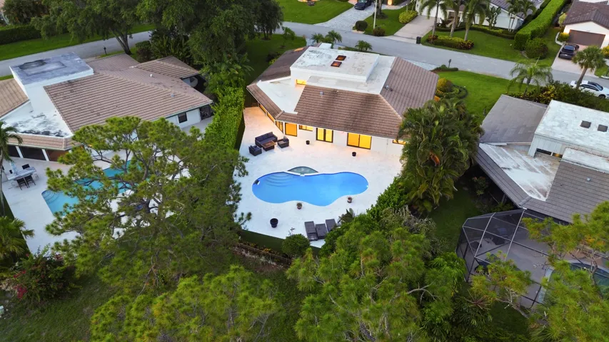 As the sun sets, this remarkable backyard transforms into a private evening retreat where luxury and nature exist in perfect harmony. Backing to a protected nature preserve, the illuminated pool and spa create a stunning focal point, while the peaceful surroundings and complete privacy offer a sense of tranquility rarely found in South Florida. Whether hosting an elegant evening under the stars or unwinding after a long day, this extraordinary outdoor oasis delivers a resort inspired lifestyle that feels worlds away, yet is just minutes from everything Delray Beach has to offer.