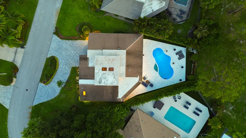 From above, the true rarity of this property comes into focus. Perfectly positioned on an oversized cul de sac lot, the home backs directly to a protected nature preserve, offering an exceptional level of privacy and lush natural surroundings that are seldom found in South Florida. Nestled within the prestigious Seagate Country Club, the only Five Star private club community located just minutes from Downtown Delray Beach, this exceptional residence offers the perfect balance of peaceful seclusion and everyday convenience. Enjoy effortless access to Atlantic Avenue's renowned boutiques, award winning restaurants, pristine beaches, and vibrant coastal lifestyle, all while returning home to the privacy and tranquility of this exclusive setting.