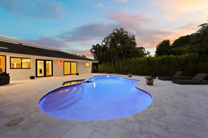 As the sun sets, this remarkable backyard transforms into a private evening retreat where luxury and nature exist in perfect harmony. Backing to a protected nature preserve, the illuminated pool and spa create a stunning focal point, while the peaceful surroundings and complete privacy offer a sense of tranquility rarely found in South Florida. Whether hosting an elegant evening under the stars or unwinding after a long day, this extraordinary outdoor oasis delivers a resort inspired lifestyle that feels worlds away, yet is just minutes from everything Delray Beach has to offer.